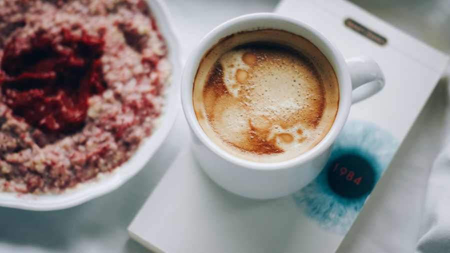 coffee cup, a book and food